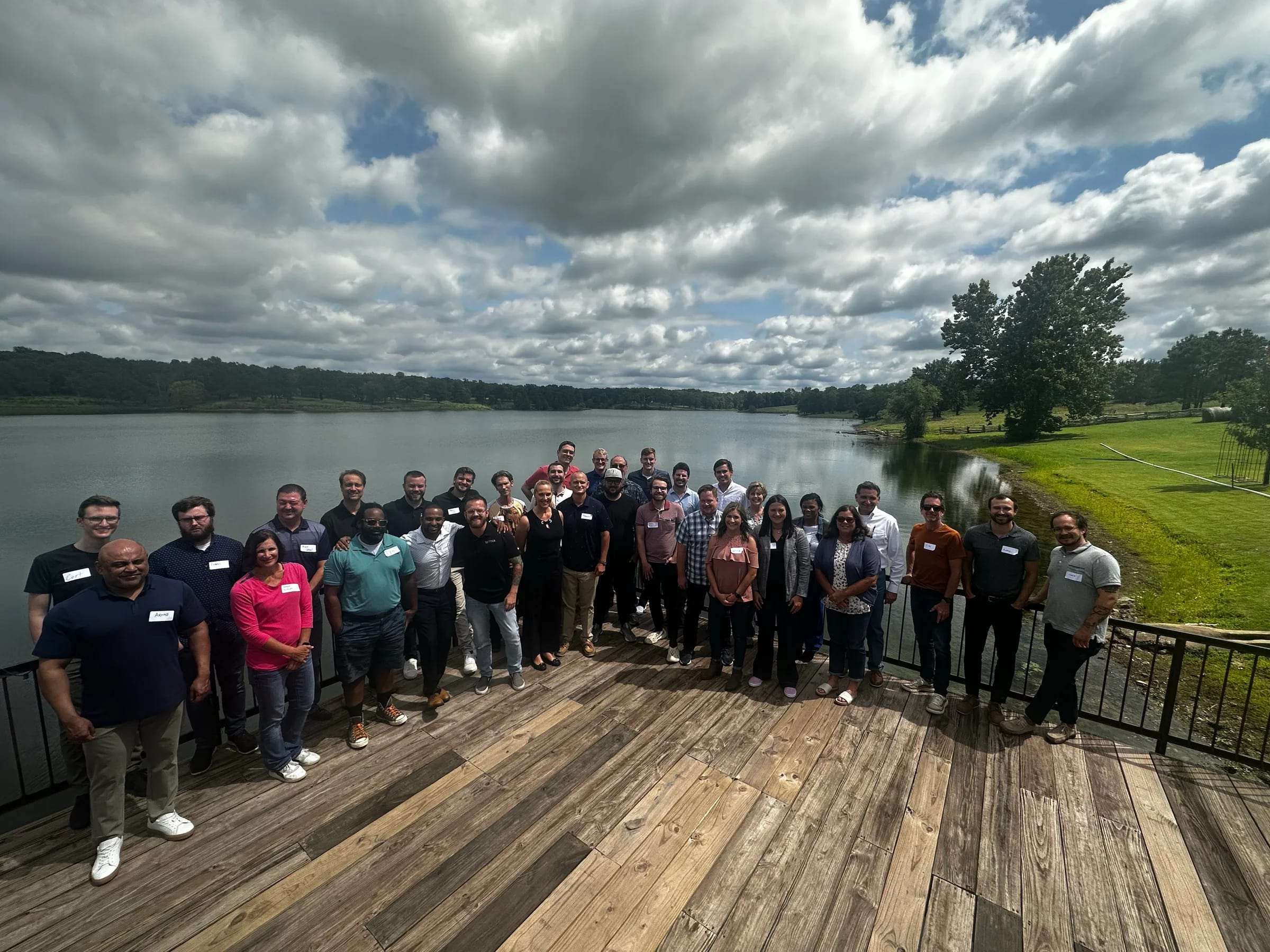 The full SEQTEK team on the deck at the annual meeting, overlooking the lake